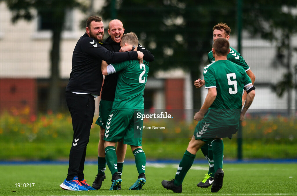 26 July 2020; Graham Curran of Usher Celtic, 2, celebrates after scoring his side's first goal with Usher Celtic manager Wesley Doyle, second from left, and team-mates during the FAI New Balance Junior Cup Quarter-Final match between Usher Celtic and Gorey Rangers at Grangegorman IT in Dublin. Competitive Soccer matches have been approved to return following the guidelines of Phase 3 of the Irish Government’s Roadmap for Reopening of Society and Business and protocols set down by the Soccer governing authorities. With games having been suspended since March, competitive games can take place with updated protocols including a limit of 200 individuals at any one outdoor event, including players, officials and a limited number of spectators, with social distancing, hand sanitisation and face masks being worn by those in attendance among other measures in an effort to contain the spread of the Coronavirus (COVID-19). Photo by Sam Barnes/Sportsfile