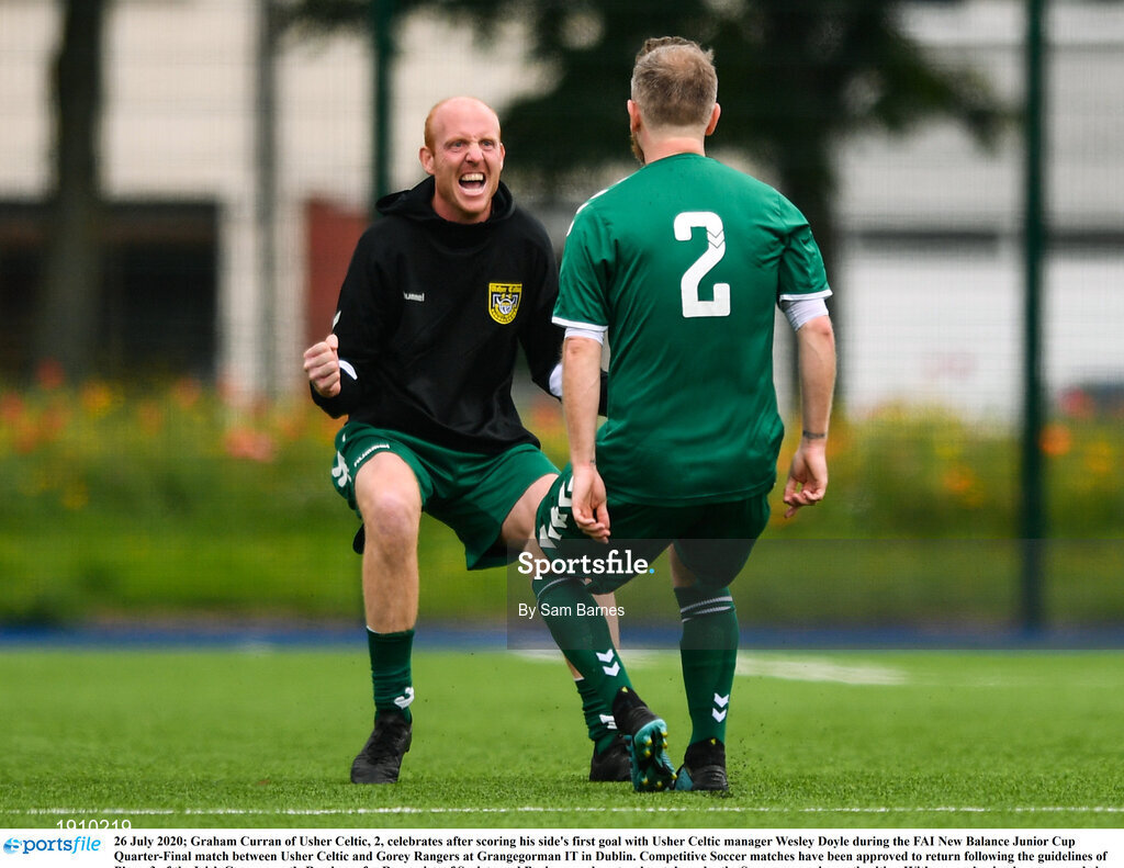 26 July 2020; Graham Curran of Usher Celtic, 2, celebrates after scoring his side's first goal with Usher Celtic manager Wesley Doyle during the FAI New Balance Junior Cup Quarter-Final match between Usher Celtic and Gorey Rangers at Grangegorman IT in Dublin. Competitive Soccer matches have been approved to return following the guidelines of Phase 3 of the Irish Government’s Roadmap for Reopening of Society and Business and protocols set down by the Soccer governing authorities. With games having been suspended since March, competitive games can take place with updated protocols including a limit of 200 individuals at any one outdoor event, including players, officials and a limited number of spectators, with social distancing, hand sanitisation and face masks being worn by those in attendance among other measures in an effort to contain the spread of the Coronavirus (COVID-19). Photo by Sam Barnes/Sportsfile