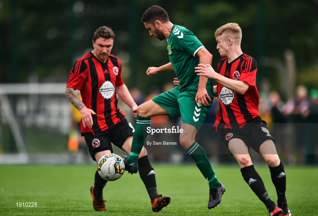 26 July 2020; Jordan Buckley of Usher Celtic in action against Conor Casserly, right, and Jonathan Savage of Gorey Rangers during the FAI New Balance Junior Cup Quarter-Final match between Usher Celtic and Gorey Rangers at Grangegorman IT in Dublin. Competitive Soccer matches have been approved to return following the guidelines of Phase 3 of the Irish Government’s Roadmap for Reopening of Society and Business and protocols set down by the Soccer governing authorities. With games having been suspended since March, competitive games can take place with updated protocols including a limit of 200 individuals at any one outdoor event, including players, officials and a limited number of spectators, with social distancing, hand sanitisation and face masks being worn by those in attendance among other measures in an effort to contain the spread of the Coronavirus (COVID-19). Photo by Sam Barnes/Sportsfile