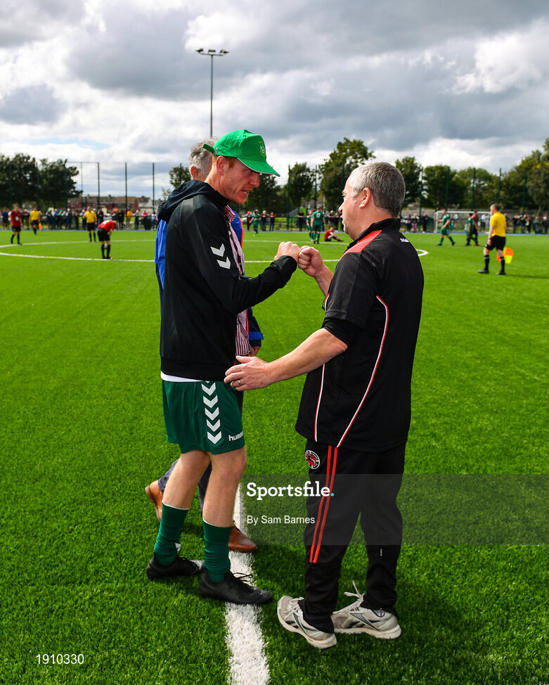 26 July 2020; Usher Celtic manager Wesley Doyle, left, and Gorey Rangers manager Ben Casserly bump fists following during the FAI New Balance Junior Cup Quarter-Final match between Usher Celtic and Gorey Rangers at Grangegorman IT in Dublin. Competitive Soccer matches have been approved to return following the guidelines of Phase 3 of the Irish Government’s Roadmap for Reopening of Society and Business and protocols set down by the Soccer governing authorities. With games having been suspended since March, competitive games can take place with updated protocols including a limit of 200 individuals at any one outdoor event, including players, officials and a limited number of spectators, with social distancing, hand sanitisation and face masks being worn by those in attendance among other measures in an effort to contain the spread of the Coronavirus (COVID-19). Photo by Sam Barnes/Sportsfile