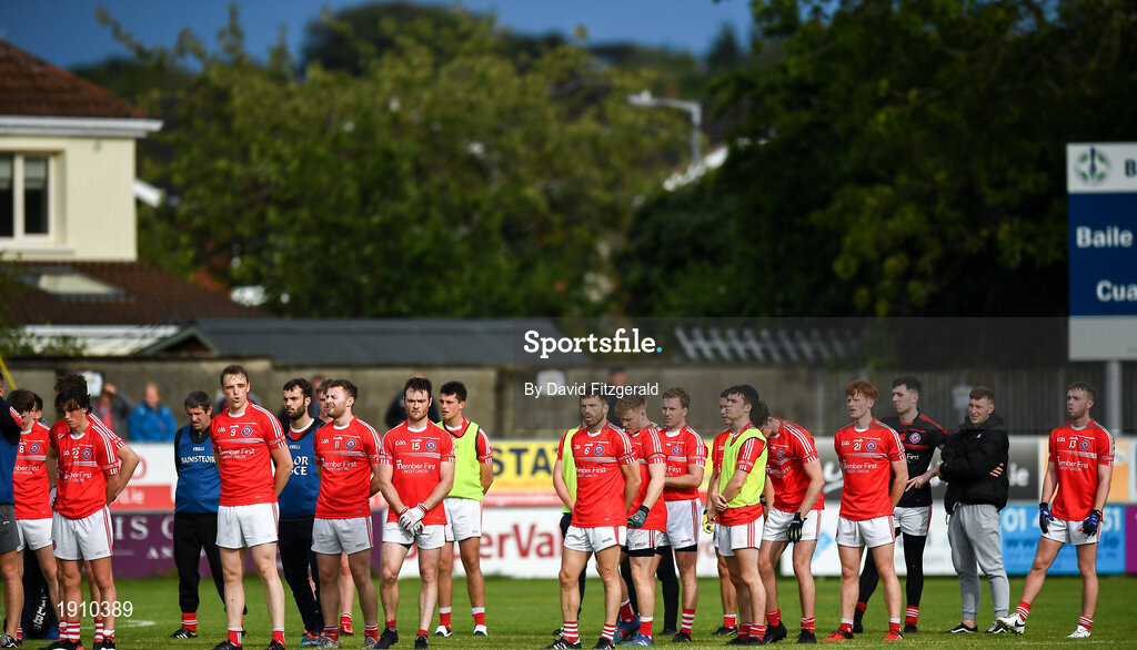25 July 2020; The Clontarf team stand for Amhrán na bhFiann prior to the Dublin County Senior Football Championship Round 1 match between Ballyboden St Endas and Clontarf at Pairc Uí Mhurchu in Dublin. GAA matches continue to take place in front of a limited number of people in an effort to contain the spread of the Coronavirus (COVID-19) pandemic. Photo by David Fitzgerald/Sportsfile