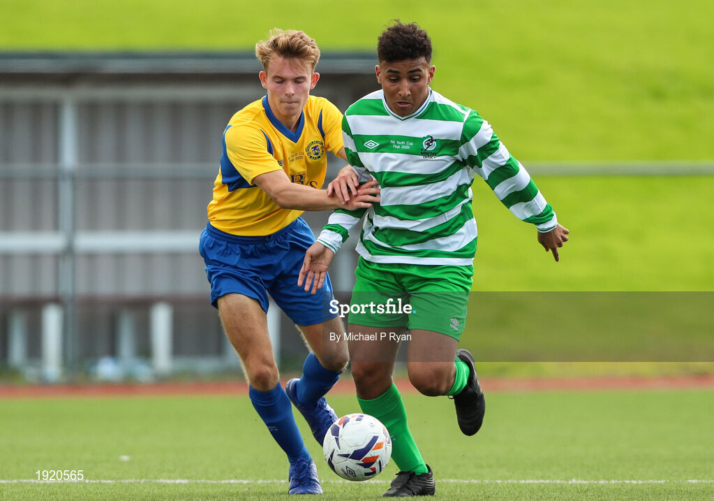 23 August 2020; Godwin Osiebe of Killarney Celtic in action against Anton Frank of Douglas Hall during the FAI Youth Cup Final match between Killarney Celtic and Douglas Hall at Mounthawk Park in Tralee, Kerry. Photo by Michael P Ryan/Sportsfile