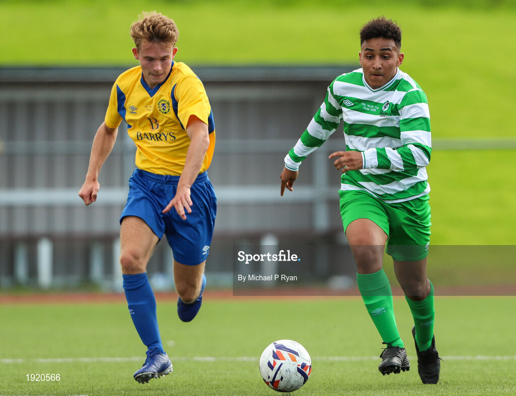 23 August 2020; Godwin Osiebe of Killarney Celtic in action against Anton Frank of Douglas Hall during the FAI Youth Cup Final match between Killarney Celtic and Douglas Hall at Mounthawk Park in Tralee, Kerry. Photo by Michael P Ryan/Sportsfile