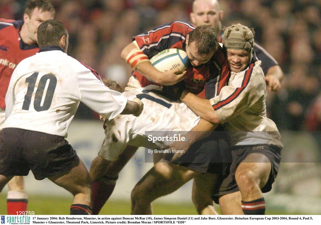 17 January 2004; Rob Henderson, Munster, in action against Duncan McRae (10), James Simpson Daniel (11) and Jake Boer, Gloucester. Heineken European Cup 2003-2004, Round 4, Pool 5, Munster v Gloucester, Thomond Park, Limerick. Picture credit; Brendan Moran / SPORTSFILE *EDI*