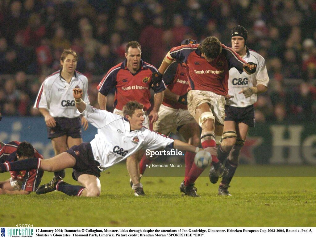 17 January 2004; Donnacha O'Callaghan, Munster, kicks through despite the attentions of Jon Goodridge, Gloucester. Heineken European Cup 2003-2004, Round 4, Pool 5, Munster v Gloucester, Thomond Park, Limerick. Picture credit; Brendan Moran / SPORTSFILE *EDI*