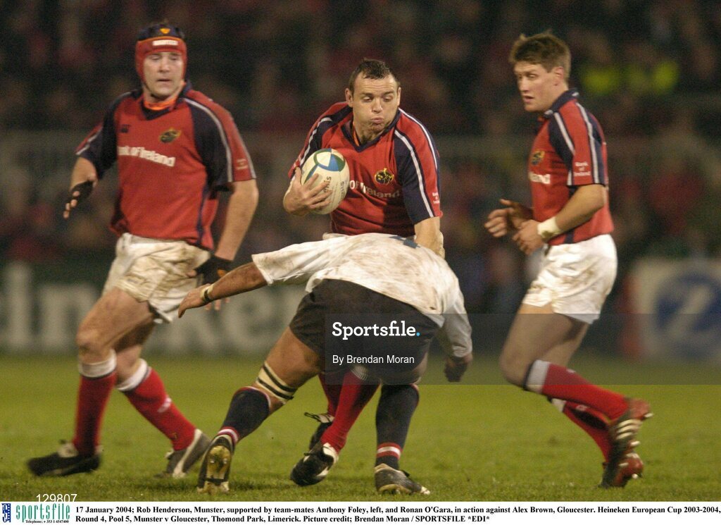 17 January 2004; Rob Henderson, Munster, supported by team-mates Anthony Foley, left, and Ronan O'Gara, in action against Alex Brown, Gloucester. Heineken European Cup 2003-2004, Round 4, Pool 5, Munster v Gloucester, Thomond Park, Limerick. Picture credit; Brendan Moran / SPORTSFILE *EDI*