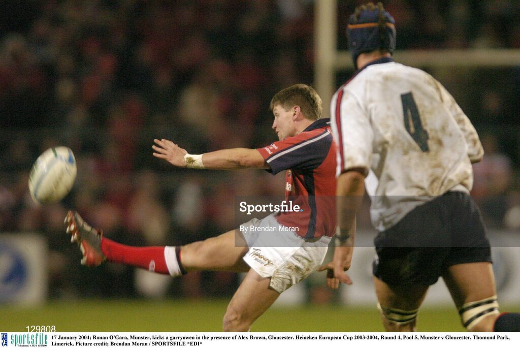17 January 2004; Ronan O'Gara, Munster, kicks a garryowen in the presence of Alex Brown, Gloucester. Heineken European Cup 2003-2004, Round 4, Pool 5, Munster v Gloucester, Thomond Park, Limerick. Picture credit; Brendan Moran / SPORTSFILE *EDI*