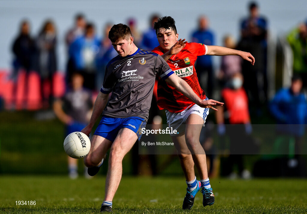 27 September 2020; Mark Whelan of Naomh Mairtin kicks a point despite the attention of Tom Jackson of Ardee St Mary's during the Louth County Senior Football Championship Final match between Naomh Mairtin and Ardee St Mary’s at Darver Louth Centre of Excellence in Louth. Photo by Ben McShane/Sportsfile