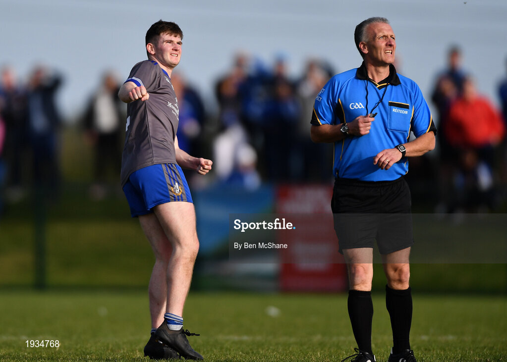 27 September 2020; Mark Whelan of Naomh Mairtin watches his kick for a point go over the bar with referee Paul Kneel during the Louth County Senior Football Championship Final match between Naomh Mairtin and Ardee St Mary’s at Darver Louth Centre of Excellence in Louth. Photo by Ben McShane/Sportsfile