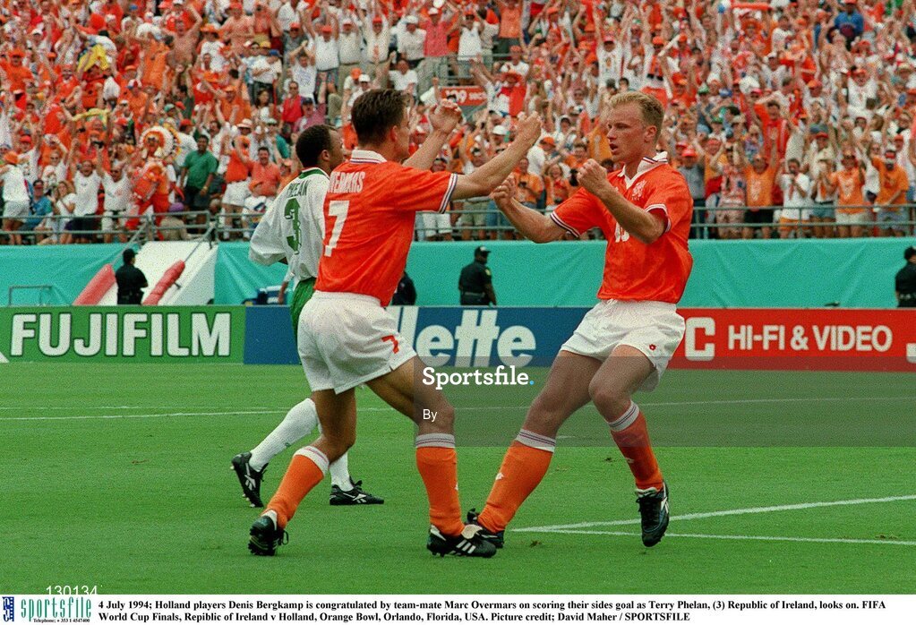 4 July 1994; Holland players Denis Bergkamp is congratulated by team-mate Marc Overmars on scoring their sides goal as Terry Phelan, (3) Republic of Ireland, looks on. FIFA World Cup Finals, Republic of Ireland v Holland, Orange Bowl, Orlando, Florida, USA. Picture credit; David Maher / SPORTSFILE