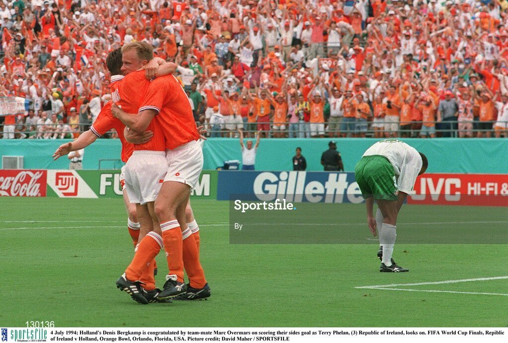 4 July 1994; Holland's Denis Bergkamp is congratulated by team-mate Marc Overmars on scoring their sides goal as Terry Phelan, (3) Republic of Ireland, looks on. FIFA World Cup Finals, Republic of Ireland v Holland, Orange Bowl, Orlando, Florida, USA. Picture credit; David Maher / SPORTSFILE