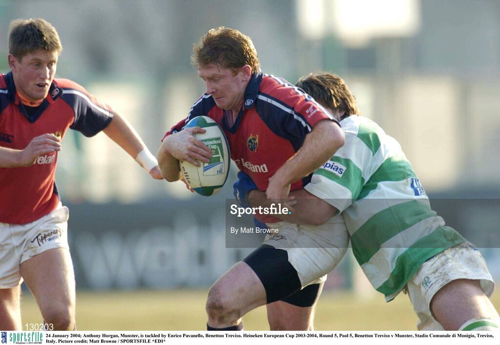 24 January 2004; Anthony Horgan, Munster, is tackled by Enrico Pavanello, Benetton Treviso. Heineken European Cup 2003-2004, Round 5, Pool 5, Benetton Treviso v Munster, Stadio Comunale di Monigio, Treviso, Italy. Picture credit; Matt Browne / SPORTSFILE *EDI*