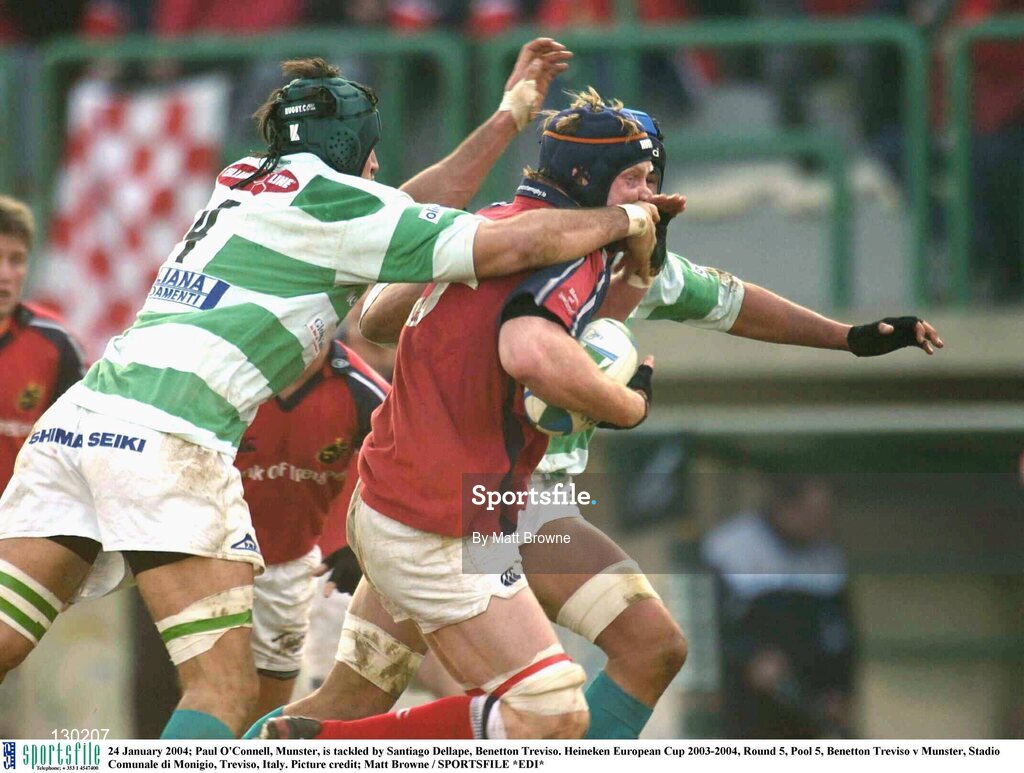 24 January 2004; Paul O'Connell, Munster, is tackled by Santiago Dellape, Benetton Treviso. Heineken European Cup 2003-2004, Round 5, Pool 5, Benetton Treviso v Munster, Stadio Comunale di Monigio, Treviso, Italy. Picture credit; Matt Browne / SPORTSFILE *EDI*