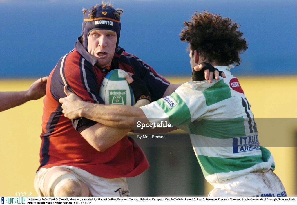 24 January 2004; Paul O'Connell, Munster, is tackled by Manuel Dallan, Benetton Treviso. Heineken European Cup 2003-2004, Round 5, Pool 5, Benetton Treviso v Munster, Stadio Comunale di Monigio, Treviso, Italy. Picture credit; Matt Browne / SPORTSFILE *EDI*