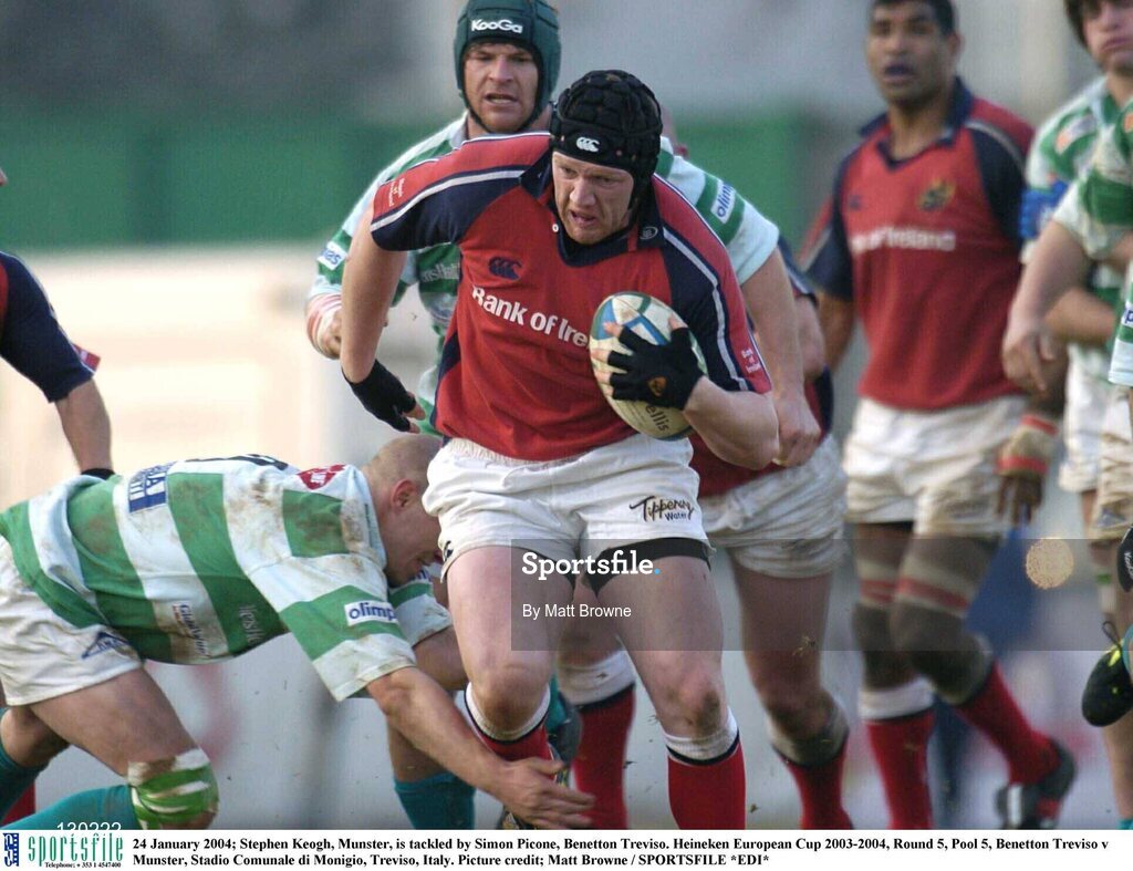24 January 2004; Stephen Keogh, Munster, is tackled by Simon Picone, Benetton Treviso. Heineken European Cup 2003-2004, Round 5, Pool 5, Benetton Treviso v Munster, Stadio Comunale di Monigio, Treviso, Italy. Picture credit; Matt Browne / SPORTSFILE *EDI*