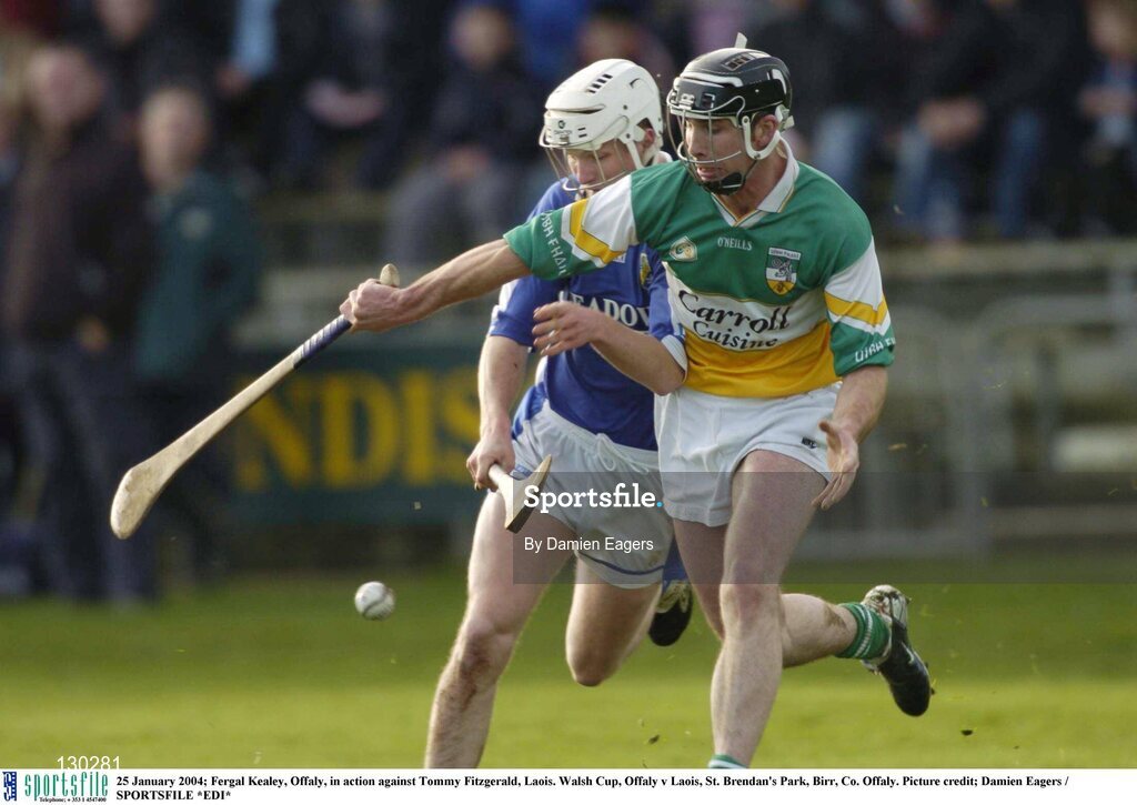 25 January 2004; Fergal Kealey of Offaly in action against Tommy Fitzgerald of Laois during the Walsh Cup match between Offaly and Laois at St Brendan's Park in Birr, Offaly. Photo by Damien Eagers/Sportsfile