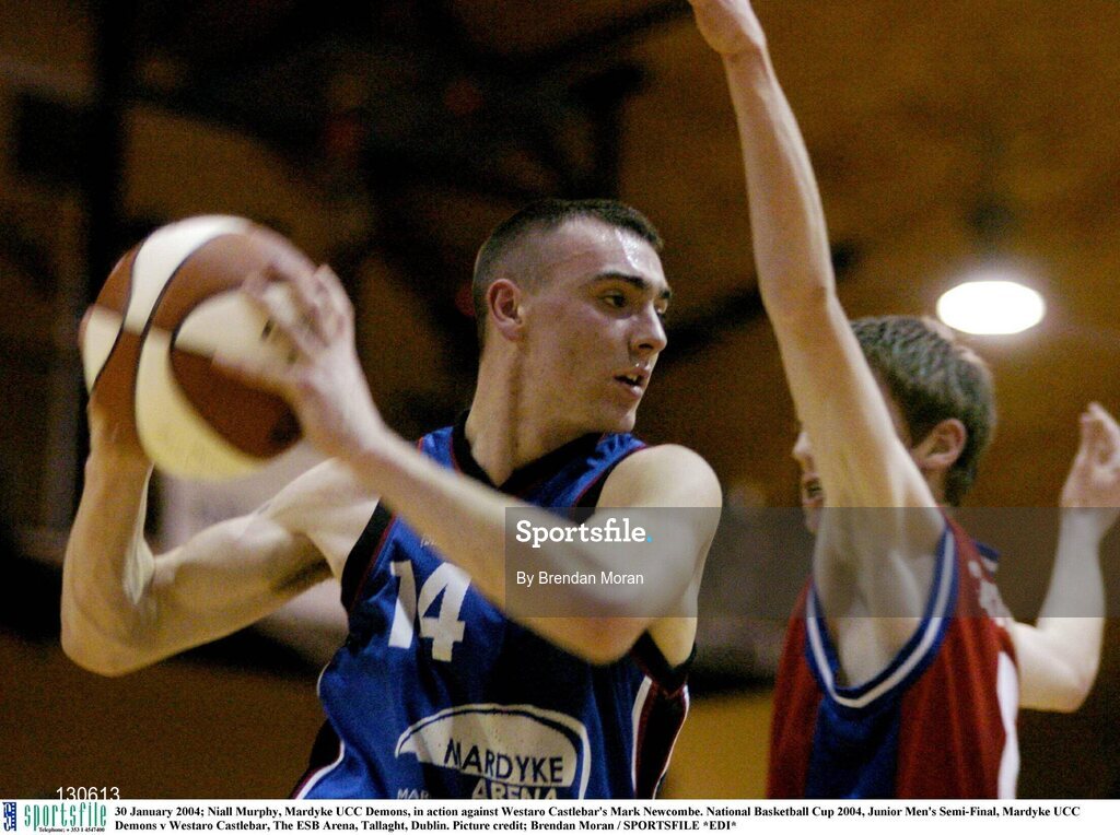 30 January 2004; Niall Murphy, Mardyke UCC Demons, in action against Westaro Castlebar's Mark Newcombe. National Basketball Cup 2004, Junior Men's Semi-Final, Mardyke UCC Demons v Westaro Castlebar, The ESB Arena, Tallaght, Dublin. Picture credit; Brendan Moran / SPORTSFILE *EDI*
