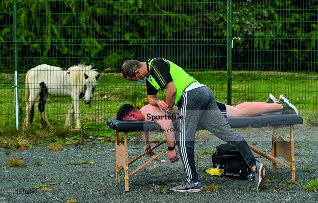 18 July 2020; David Keogh of Thomas Davis receives treatment from team physio Carl O'Toole ahead of the Dublin County Senior Hurling Championship Group 4 Round 1 match between Cuala and Thomas Davis at Bray Emmets GAA club in Bray, Wicklow. Competitive GAA matches have been approved to return following the guidelines of Phase 3 of the Irish Government’s Roadmap for Reopening of Society and Business and protocols set down by the GAA governing authorities. With games having been suspended since March, competitive games can take place with updated protocols including a limit of 200 individuals at any one outdoor event, including players, officials and a limited number of spectators, with social distancing, hand sanitisation and face masks being worn by those in attendance among other measures in an effort to contain the spread of the Coronavirus (COVID-19) pandemic. Photo by Ramsey Cardy/Sportsfile