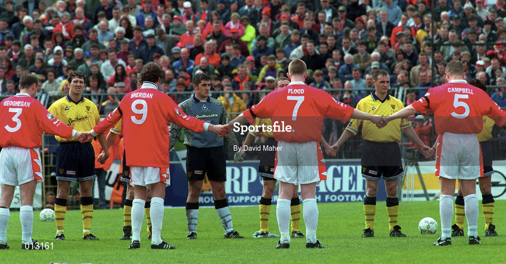 4 May 1997; Players from both teams hold a minute's silence following the death of Conor O'Dowd, brother of Derry City goalkeeper Tony O'Dowd, prior to the FAI Cup Final match between Derry City and Shelbourne at Dalymount Park in Dublin. Photo by David Maher/Sportsfile