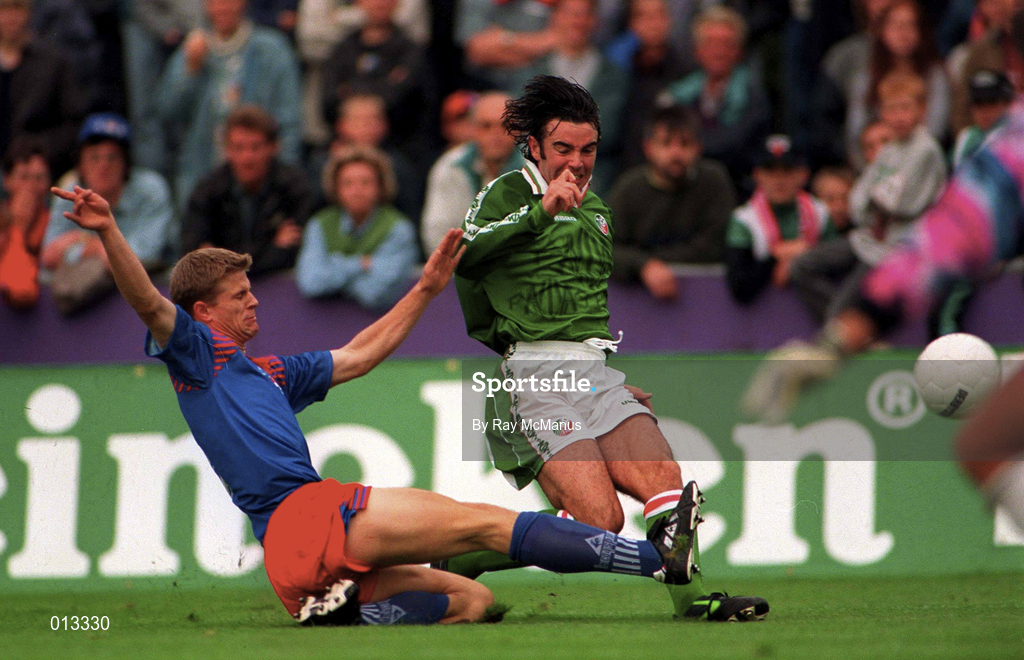 31 August 1996; Keith O'Neill of Republic of Ireland takes a shot under pressure from Daniel Telser of Liechtenstein during the FIFA World Cup 1998 Group 8 Qualifying match between Liechtenstein and Republic of Ireland at Eschen-Mauren Sportpark, Eschen in Liechtenstein. Photo by Ray McManus/Sportsfile