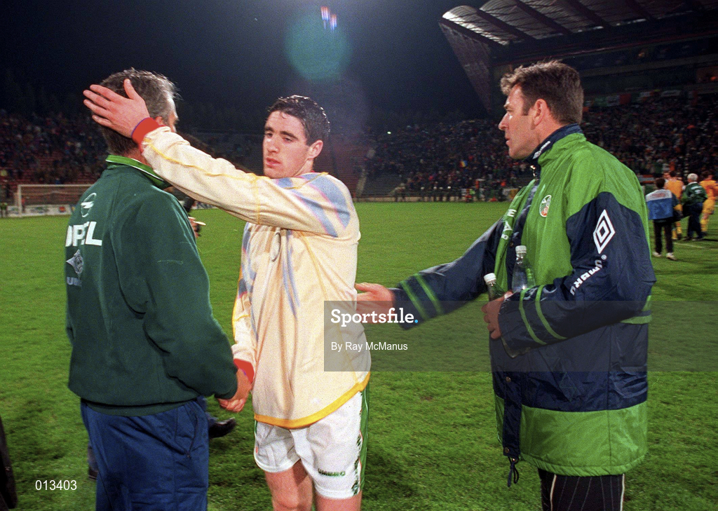 30 April 1997; Mark Kennedy of Republic of Ireland, centre, shakes hands with manager Mick McCarthy, left, alongside team-mate Packie Bonner, following the FIFA World Cup 1998 Group 8 Qualifiying match between Romania and Republic of Ireland at Stadionul Steaua in Bucharest, Romania. Photo by Ray McManus/Sportsfile
