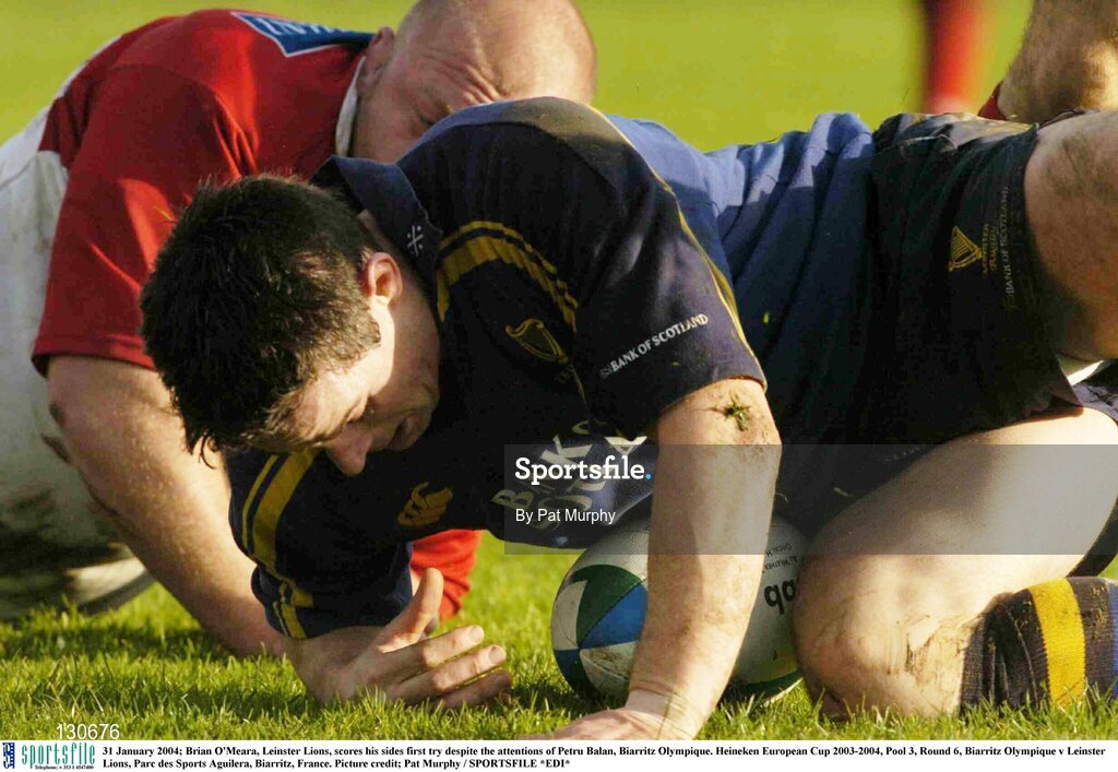 31 January 2004; Brian O'Meara, Leinster Lions, scores his sides first try despite the attentions of Petru Balan, Biarritz Olympique. Heineken European Cup 2003-2004, Pool 3, Round 6, Biarritz Olympique v Leinster Lions, Parc des Sports Aguilera, Biarritz, France. Picture credit; Pat Murphy / SPORTSFILE *EDI*