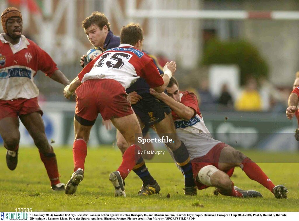 31 January 2004; Gordon D'Arcy, Leinster Lions, in action against Nicolas Brusque, 15, and Martin Gaitan, Biarritz Olympique. Heineken European Cup 2003-2004, Pool 3, Round 6, Biarritz Olympique v Leinster Lions, Parc des Sports Aguilera, Biarritz, France. Picture credit; Pat Murphy / SPORTSFILE *EDI*