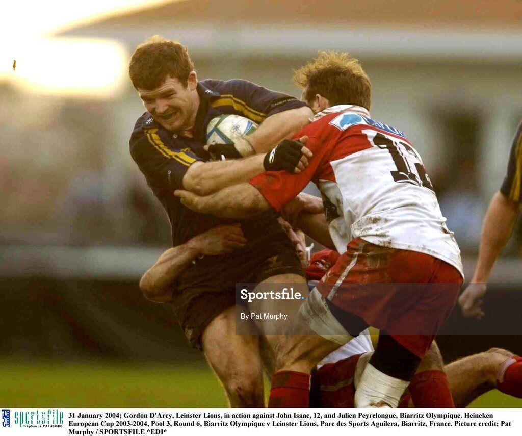 31 January 2004; Gordon D'Arcy, Leinster Lions, in action against John Isaac, 12, and Julien Peyrelongue, Biarritz Olympique. Heineken European Cup 2003-2004, Pool 3, Round 6, Biarritz Olympique v Leinster Lions, Parc des Sports Aguilera, Biarritz, France. Picture credit; Pat Murphy / SPORTSFILE *EDI*