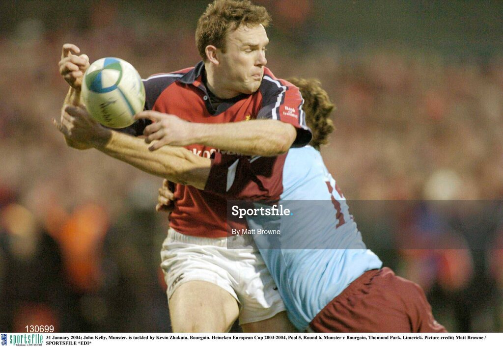 31 January 2004; John Kelly, Munster, is tackled by Kevin Zhakata, Bourgoin. Heineken European Cup 2003-2004, Pool 5, Round 6, Munster v Bourgoin, Thomond Park, Limerick. Picture credit; Matt Browne / SPORTSFILE *EDI*