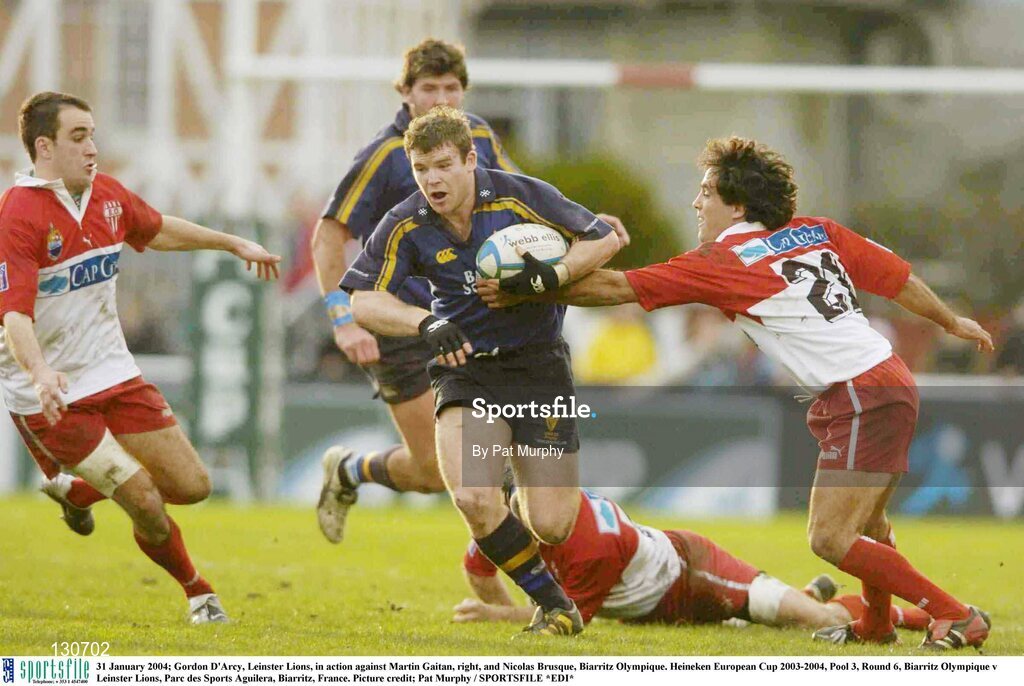 31 January 2004; Gordon D'Arcy, Leinster Lions, in action against Martin Gaitan, right, and Nicolas Brusque, Biarritz Olympique. Heineken European Cup 2003-2004, Pool 3, Round 6, Biarritz Olympique v Leinster Lions, Parc des Sports Aguilera, Biarritz, France. Picture credit; Pat Murphy / SPORTSFILE *EDI*