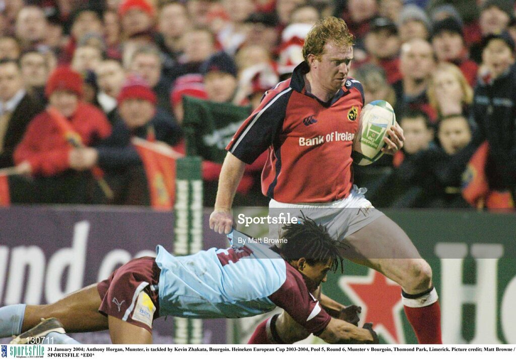 31 January 2004; Anthony Horgan, Munster, is tackled by Kevin Zhakata, Bourgoin. Heineken European Cup 2003-2004, Pool 5, Round 6, Munster v Bourgoin, Thomond Park, Limerick. Picture credit; Matt Browne / SPORTSFILE *EDI*