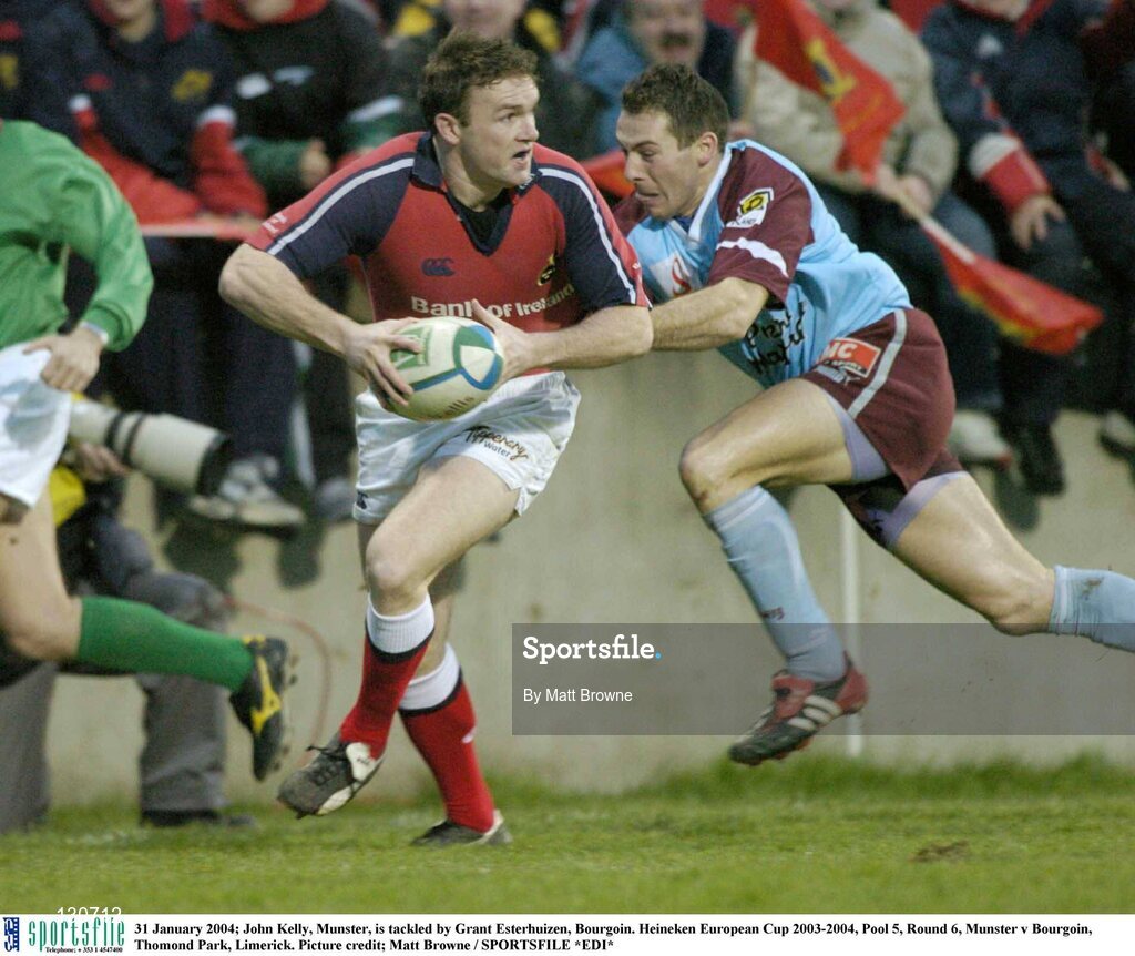 31 January 2004; John Kelly, Munster, is tackled by Grant Esterhuizen, Bourgoin. Heineken European Cup 2003-2004, Pool 5, Round 6, Munster v Bourgoin, Thomond Park, Limerick. Picture credit; Matt Browne / SPORTSFILE *EDI*