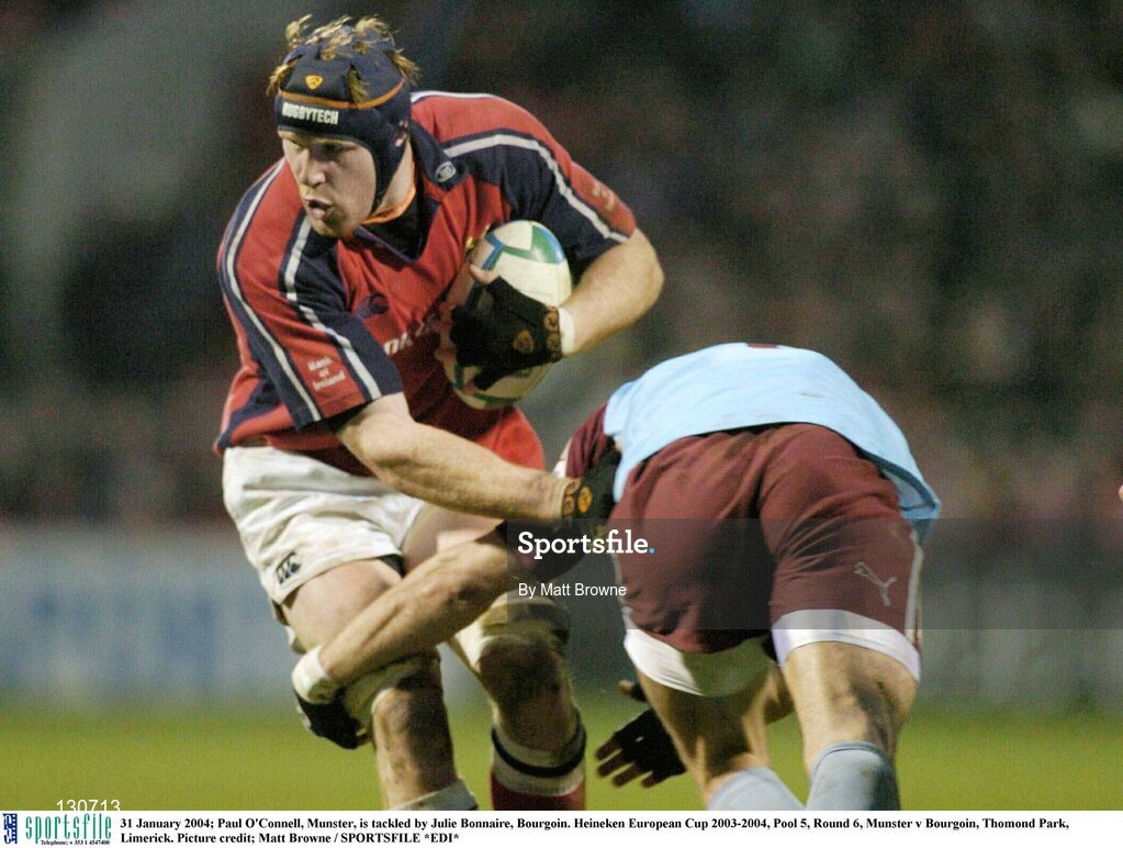 31 January 2004; Paul O'Connell, Munster, is tackled by Julie Bonnaire, Bourgoin. Heineken European Cup 2003-2004, Pool 5, Round 6, Munster v Bourgoin, Thomond Park, Limerick. Picture credit; Matt Browne / SPORTSFILE *EDI*