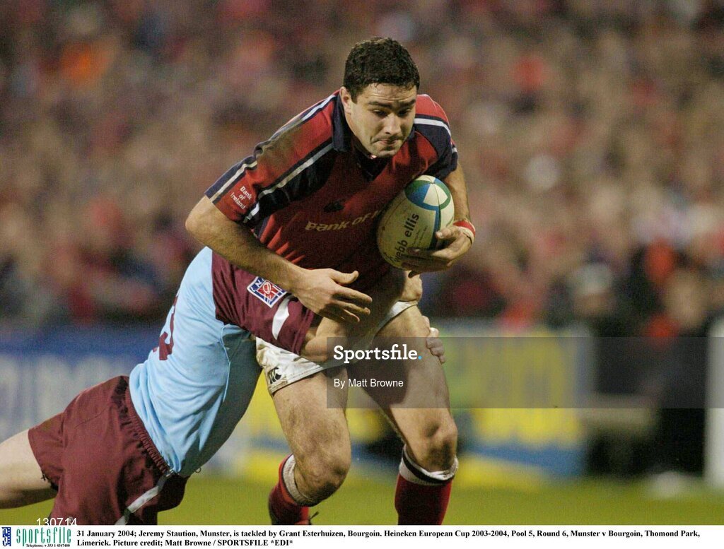 31 January 2004; Jeremy Staution, Munster, is tackled by Grant Esterhuizen, Bourgoin. Heineken European Cup 2003-2004, Pool 5, Round 6, Munster v Bourgoin, Thomond Park, Limerick. Picture credit; Matt Browne / SPORTSFILE *EDI*