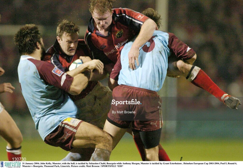 31 January 2004; John Kelly, Munster, with the ball, is tackled by Sebastien Chabl, Bourgoin while Anthony Horgan, Munster is tackled by Grant Esterhuizen . Heineken European Cup 2003-2004, Pool 5, Round 6, Munster v Bourgoin, Thomond Park, Limerick. Picture credit; Matt Browne / SPORTSFILE *EDI*