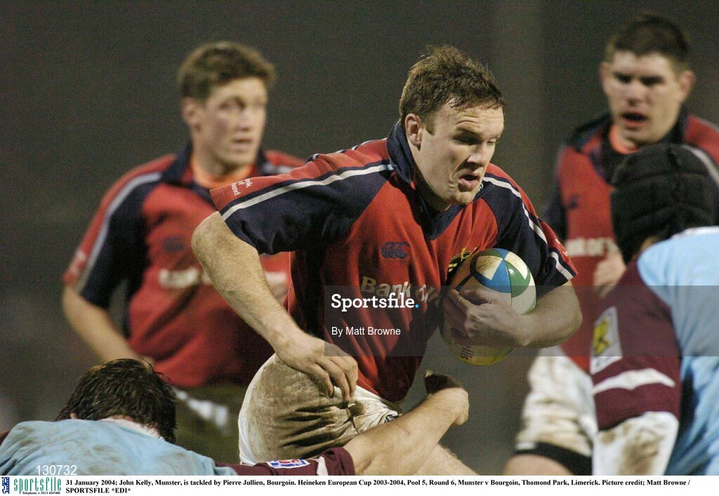 31 January 2004; John Kelly, Munster, is tackled by Pierre Jullien, Bourgoin. Heineken European Cup 2003-2004, Pool 5, Round 6, Munster v Bourgoin, Thomond Park, Limerick. Picture credit; Matt Browne / SPORTSFILE *EDI*