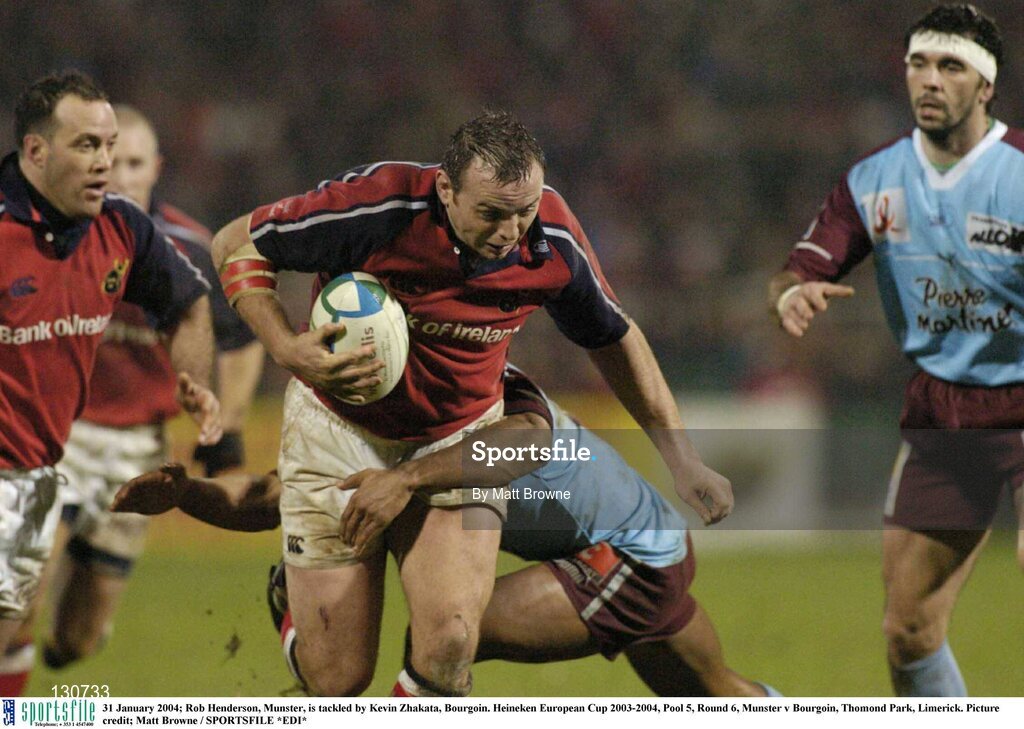 31 January 2004; Rob Henderson, Munster, is tackled by Kevin Zhakata, Bourgoin. Heineken European Cup 2003-2004, Pool 5, Round 6, Munster v Bourgoin, Thomond Park, Limerick. Picture credit; Matt Browne / SPORTSFILE *EDI*