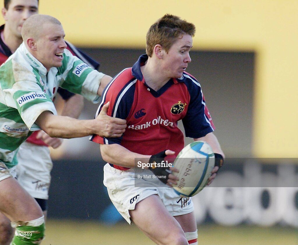24 January 2004; Eoin Reddan, Munster, is tackled by Simon Picone, Benetton Treviso. Heineken European Cup 2003-2004, Round 5, Pool 5, Benetton Treviso v Munster, Stadio Comunale di Monigio, Treviso, Italy. Picture credit; Matt Browne / SPORTSFILE *EDI*