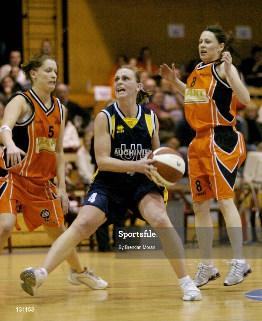 30 January 2004; Michelle Aspell, University of Limerick, in action against Dart Killester's Leesa Grennell, 5, and Emma Pierce. ESB National Cup 2004, Senior Women's Semi-Final, University of Limerick v Dart Killester, The ESB Arena, Tallaght, Dublin. Picture credit; Brendan Moran / SPORTSFILE *EDI*