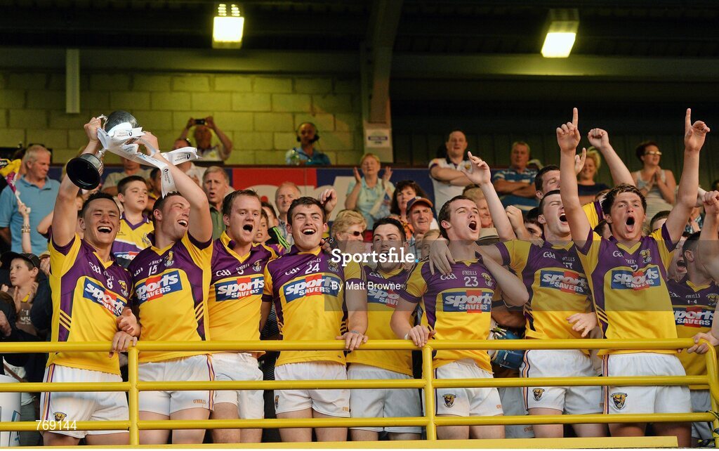 10 July 2013; Wexford captain Lee Chin lifts the Robbins Cup with team-mate Rhys Clarke. Bord Gáis Energy Leinster GAA Hurling Under 21 Championship Final, Kilkenny v Wexford, Wexford Park, Wexford. Picture credit: Matt Browne / SPORTSFILE