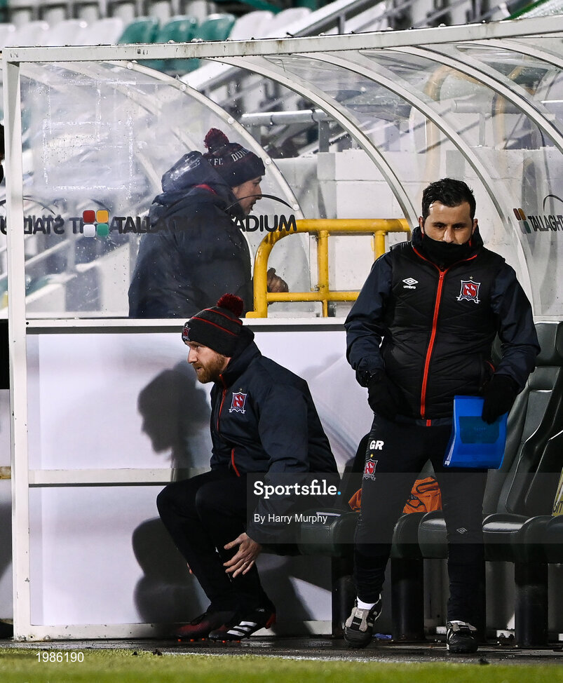 12 March 2021; Dundalk coach Filippo Giovagnoli makes his way into the stand as Dundalk team manager Shane Keegan and Dundalk coach Giuseppi Rossi sit in the dugout prior to the FAI President's Cup Final match between Shamrock Rovers and Dundalk at Tallaght Stadium in Dublin. Photo by Harry Murphy/Sportsfile