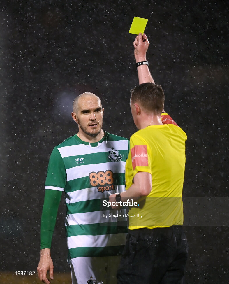 12 March 2021; Joey O'Brien of Shamrock Rovers receives a yellow card from referee Damien MacGraith during the FAI President's Cup Final match between Shamrock Rovers and Dundalk at Tallaght Stadium in Dublin. Photo by Stephen McCarthy/Sportsfile