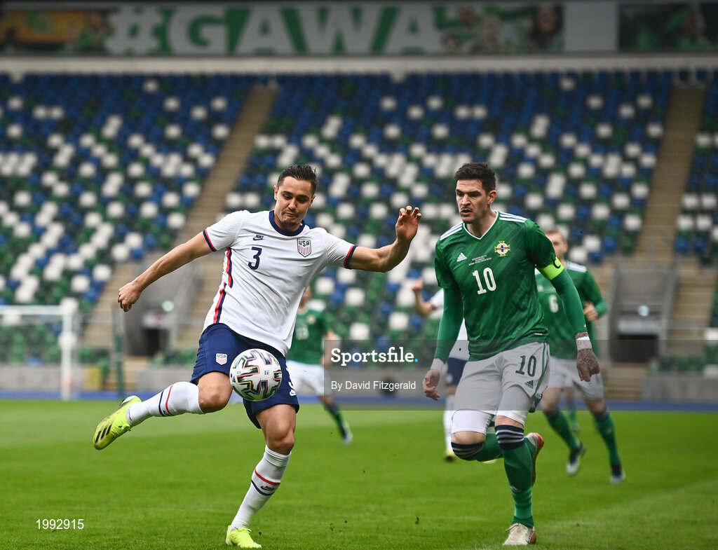 28 March 2021; Aaron Long of USA in action against Kyle Lafferty of Northern Ireland during the International friendly match between Northern Ireland and USA at the National Football Stadium at Windsor Park in Belfast. Photo by David Fitzgerald/Sportsfile