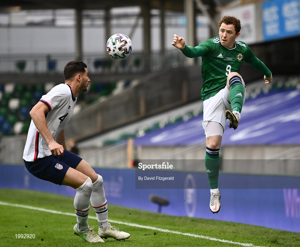 28 March 2021; Shayne Lavery of Northern Ireland in action against Matthew Miazga of USA during the International friendly match between Northern Ireland and USA at the National Football Stadium at Windsor Park in Belfast. Photo by David Fitzgerald/Sportsfile