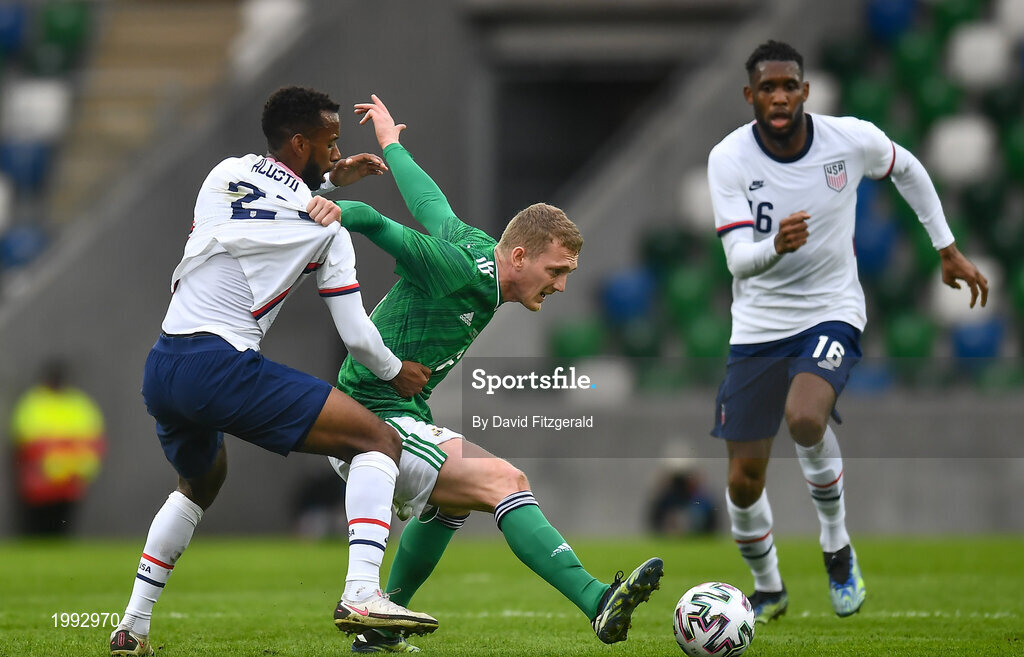 28 March 2021; George Saville of Northern Ireland in action against Kellyn Acosta of USA during the International friendly match between Northern Ireland and USA at the National Football Stadium at Windsor Park in Belfast. Photo by David Fitzgerald/Sportsfile