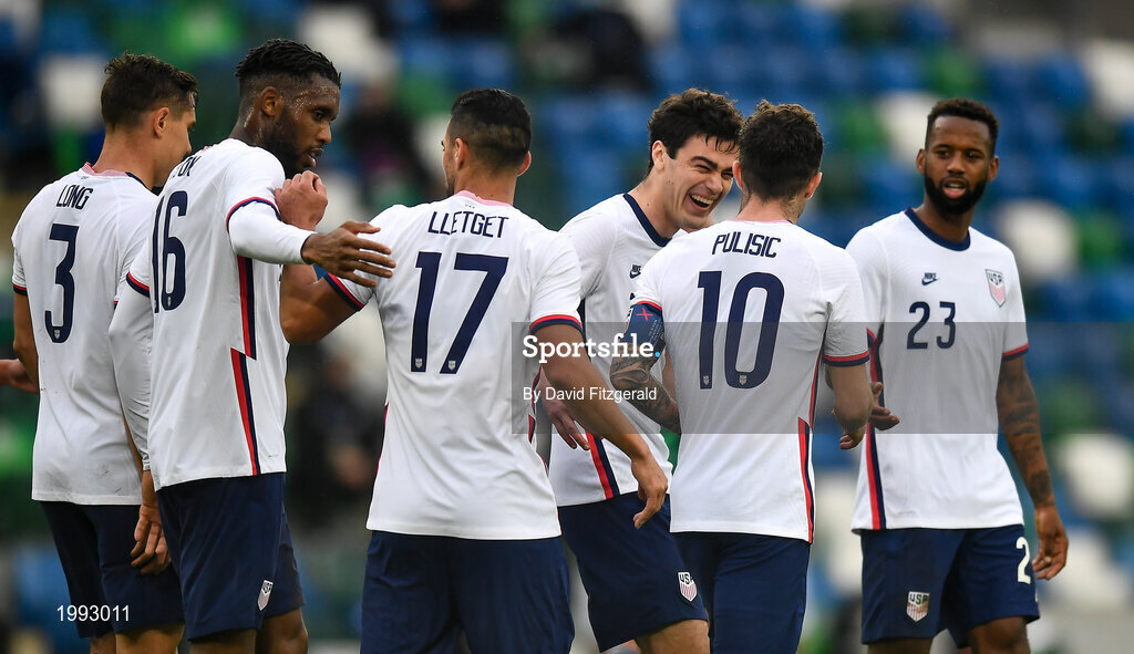 28 March 2021; Christian Pulišic, 10, of USA is congratulated by teammates, including Giovanni Reyna, after scoring his side's second goal from a penalty during the International friendly match between Northern Ireland and USA at the National Football Stadium at Windsor Park in Belfast. Photo by David Fitzgerald/Sportsfile