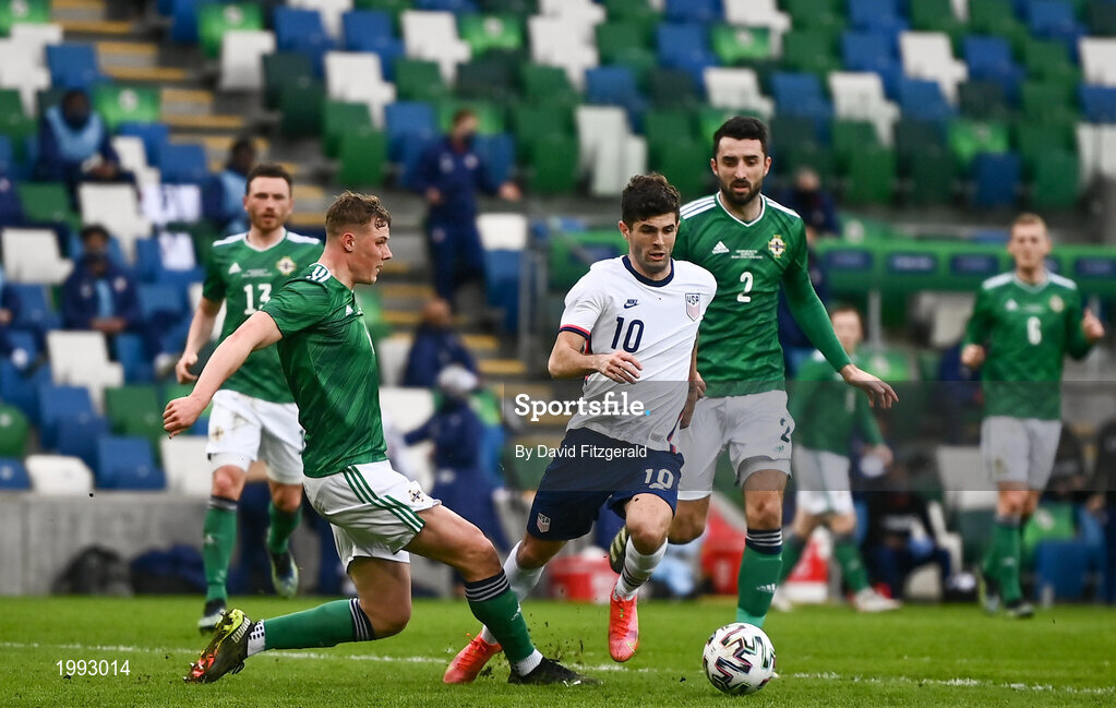 28 March 2021; Christian Pulišic of USA is fouled by Daniel Ballard of Northern Ireland, resulting in a penalty, during the International friendly match between Northern Ireland and USA at the National Football Stadium at Windsor Park in Belfast. Photo by David Fitzgerald/Sportsfile