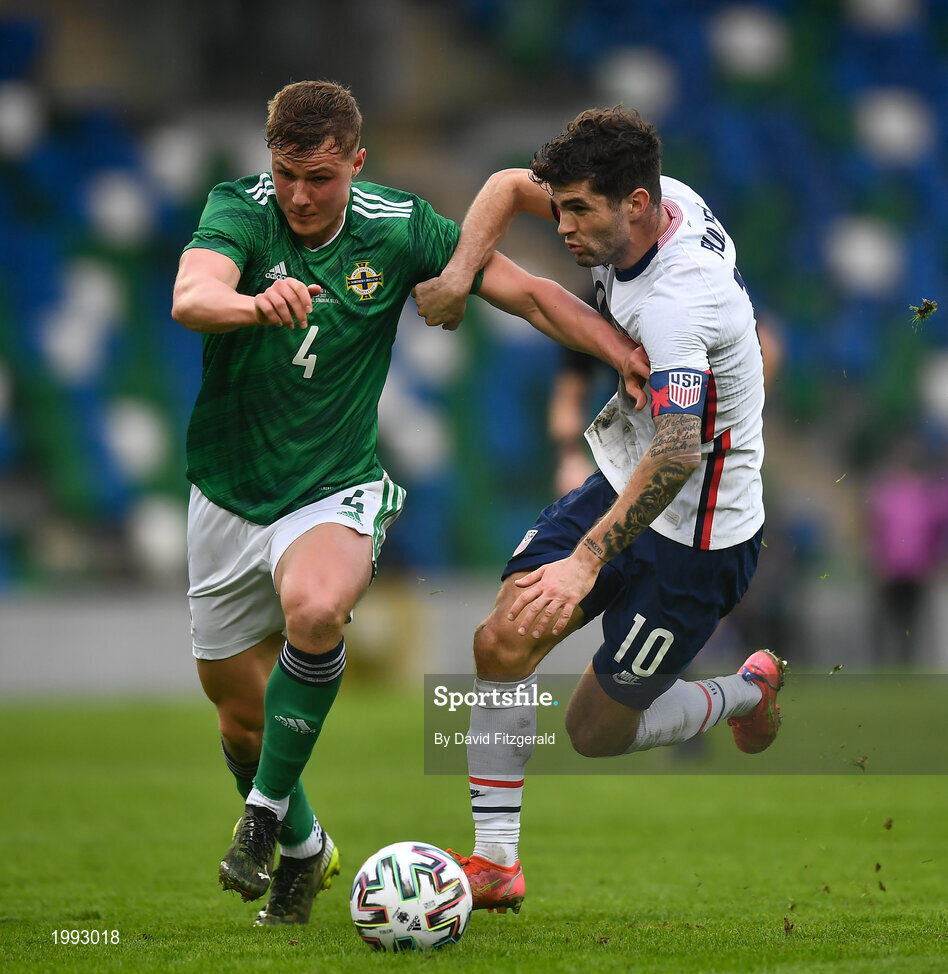 28 March 2021; Christian Pulišic of USA in action against Daniel Ballard of Northern Ireland during the International friendly match between Northern Ireland and USA at the National Football Stadium at Windsor Park in Belfast. Photo by David Fitzgerald/Sportsfile