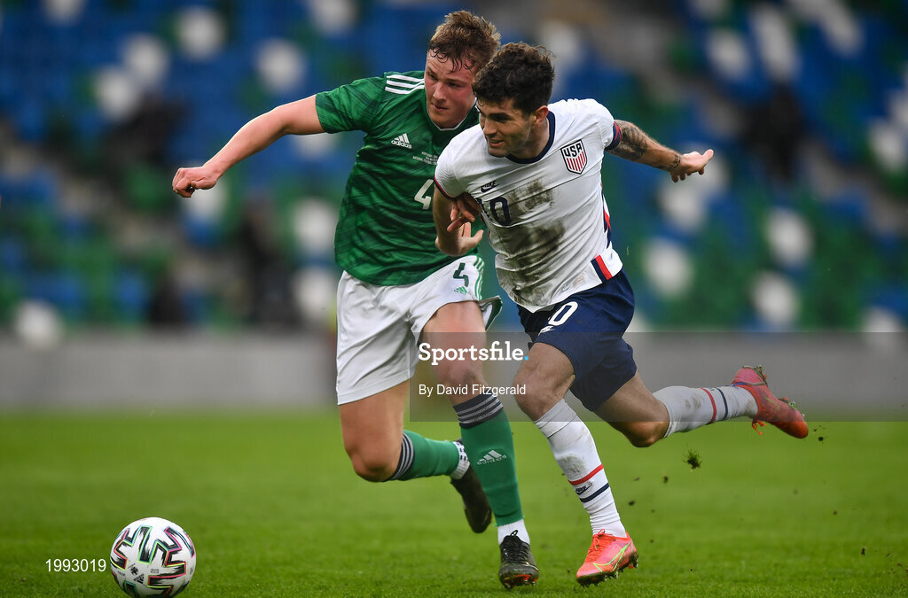 28 March 2021; Christian Pulišic of USA in action against Daniel Ballard of Northern Ireland during the International friendly match between Northern Ireland and USA at the National Football Stadium at Windsor Park in Belfast. Photo by David Fitzgerald/Sportsfile