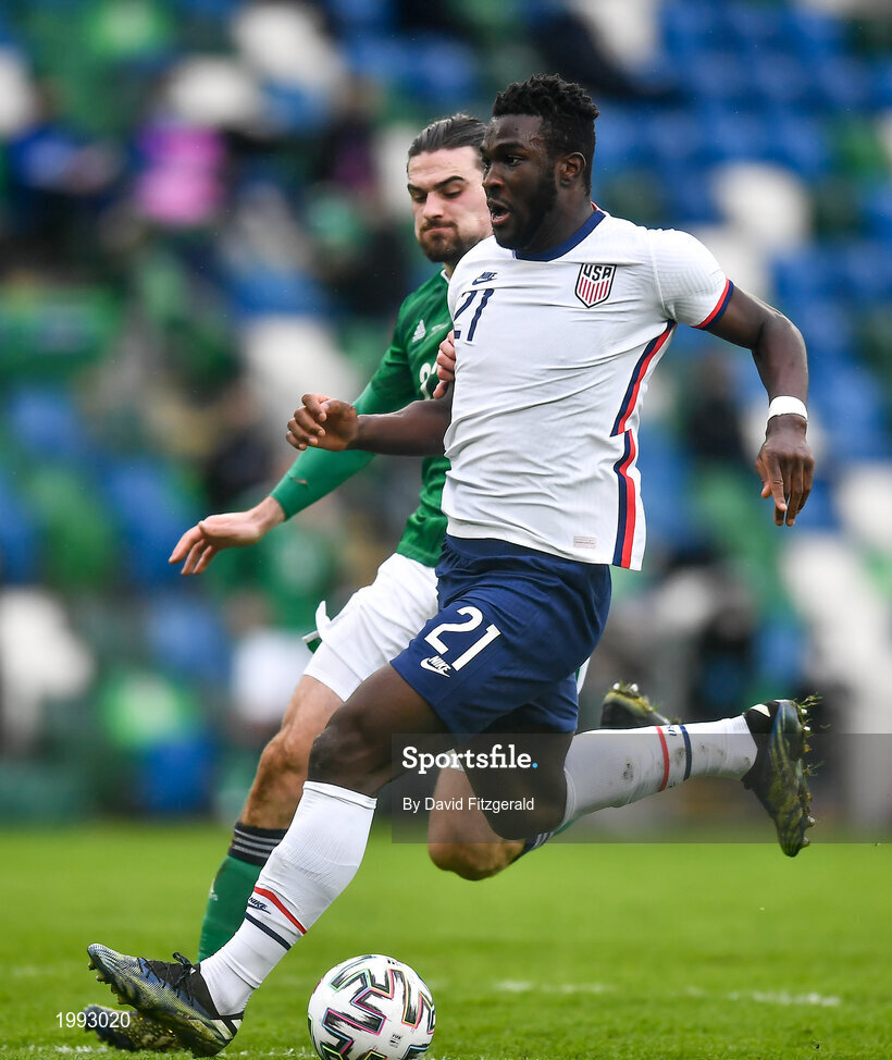28 March 2021; Daryl Dike of USA in action against Ciaron Brown of Northern Ireland during the International friendly match between Northern Ireland and USA at the National Football Stadium at Windsor Park in Belfast. Photo by David Fitzgerald/Sportsfile